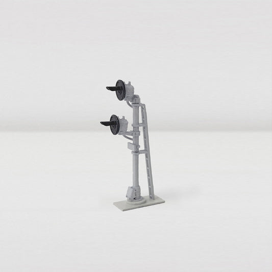 Side view of freestanding N scale double head searchlight railroad signal.