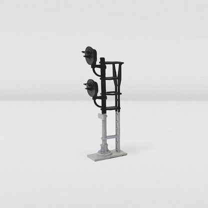 Front view of a g-type model railroad signal with two heads.